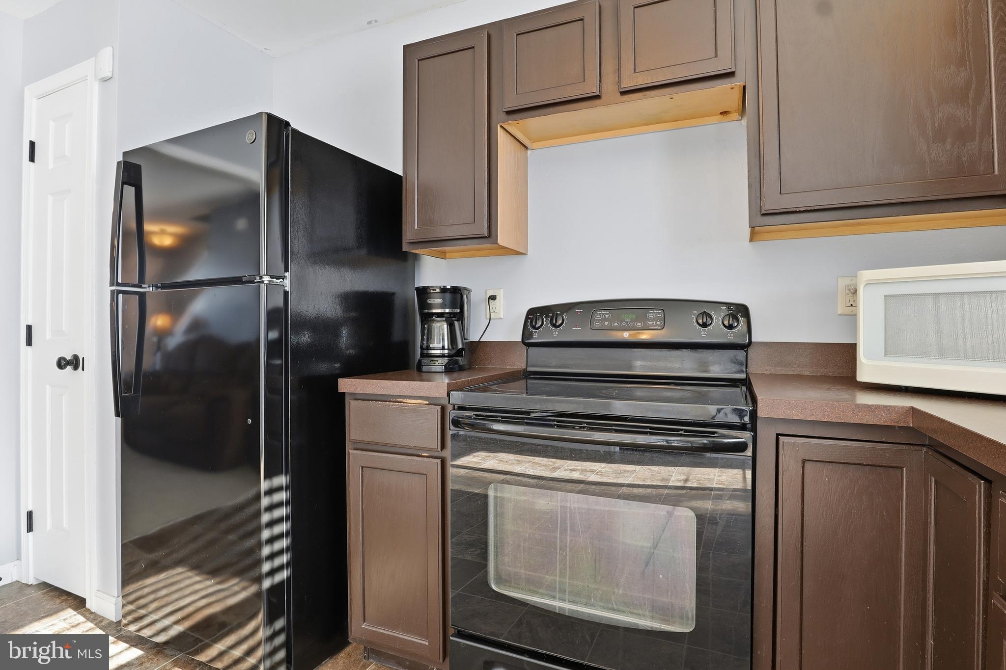 370 Azalea Drive Windsor, PA 17366 - Photo 12 of 40 a kitchen with cabinets and stainless steel appliances