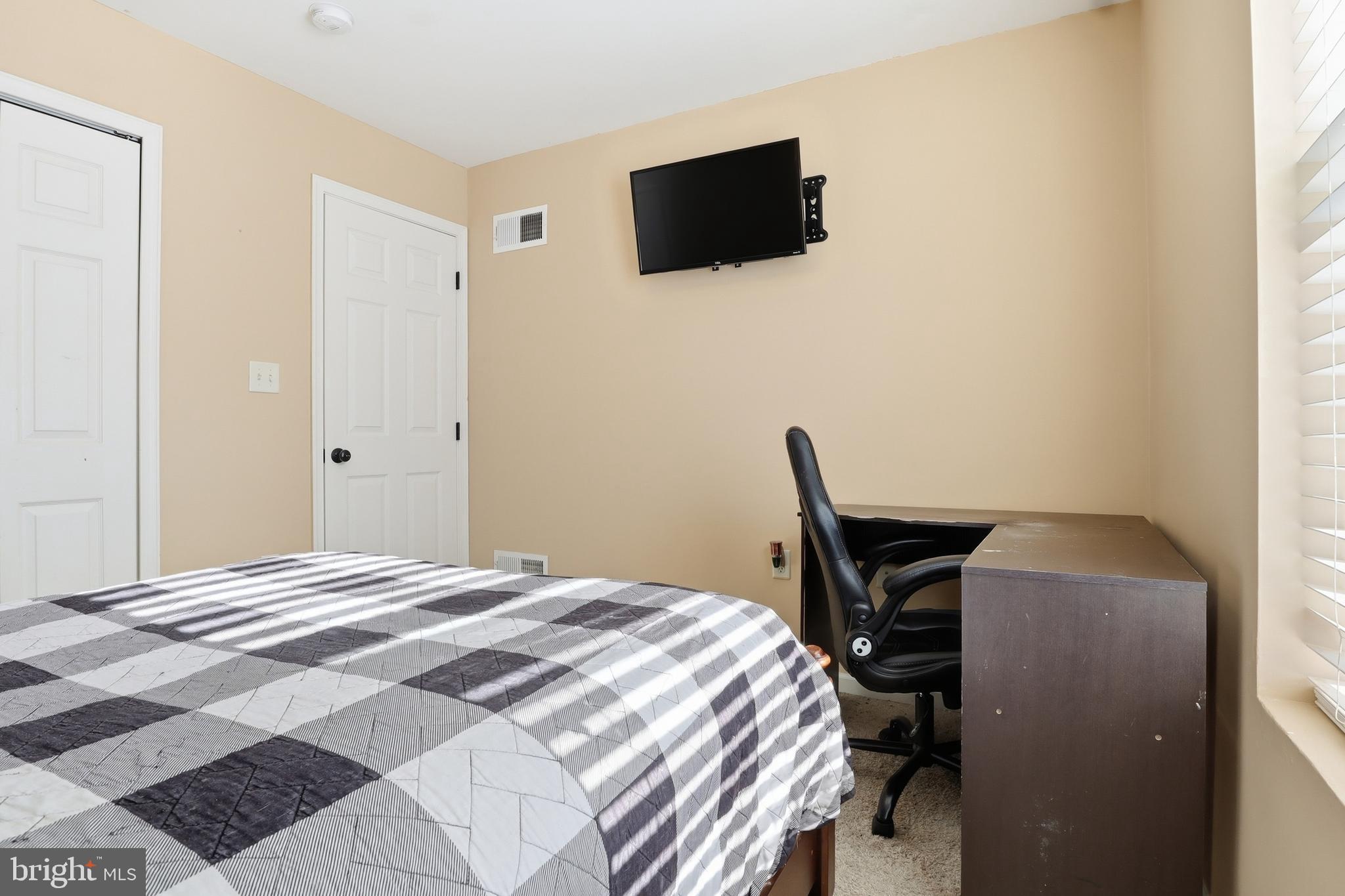 370 Azalea Drive Windsor, PA 17366 - Photo 22 of 40 a bedroom with a bed and a flat screen tv