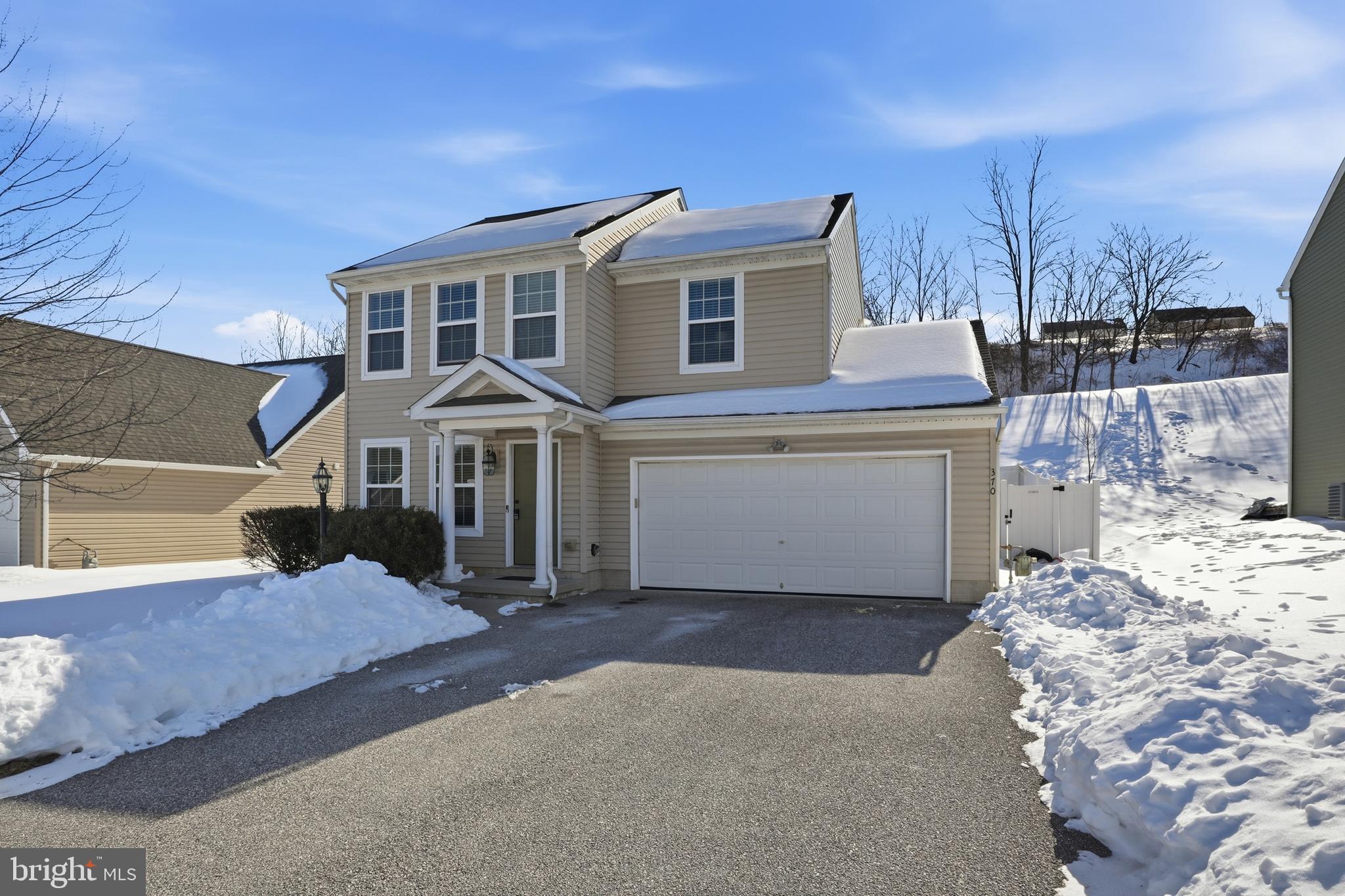 370 Azalea Drive Windsor, PA 17366 - Photo 3 of 40 a front view of a house with a yard