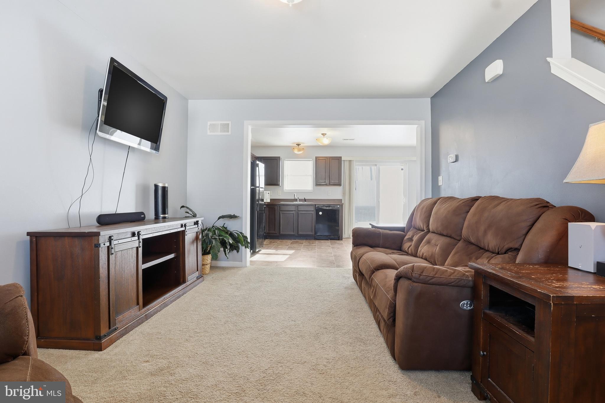 370 Azalea Drive Windsor, PA 17366 - Photo 7 of 40 a living room with furniture and a flat screen tv