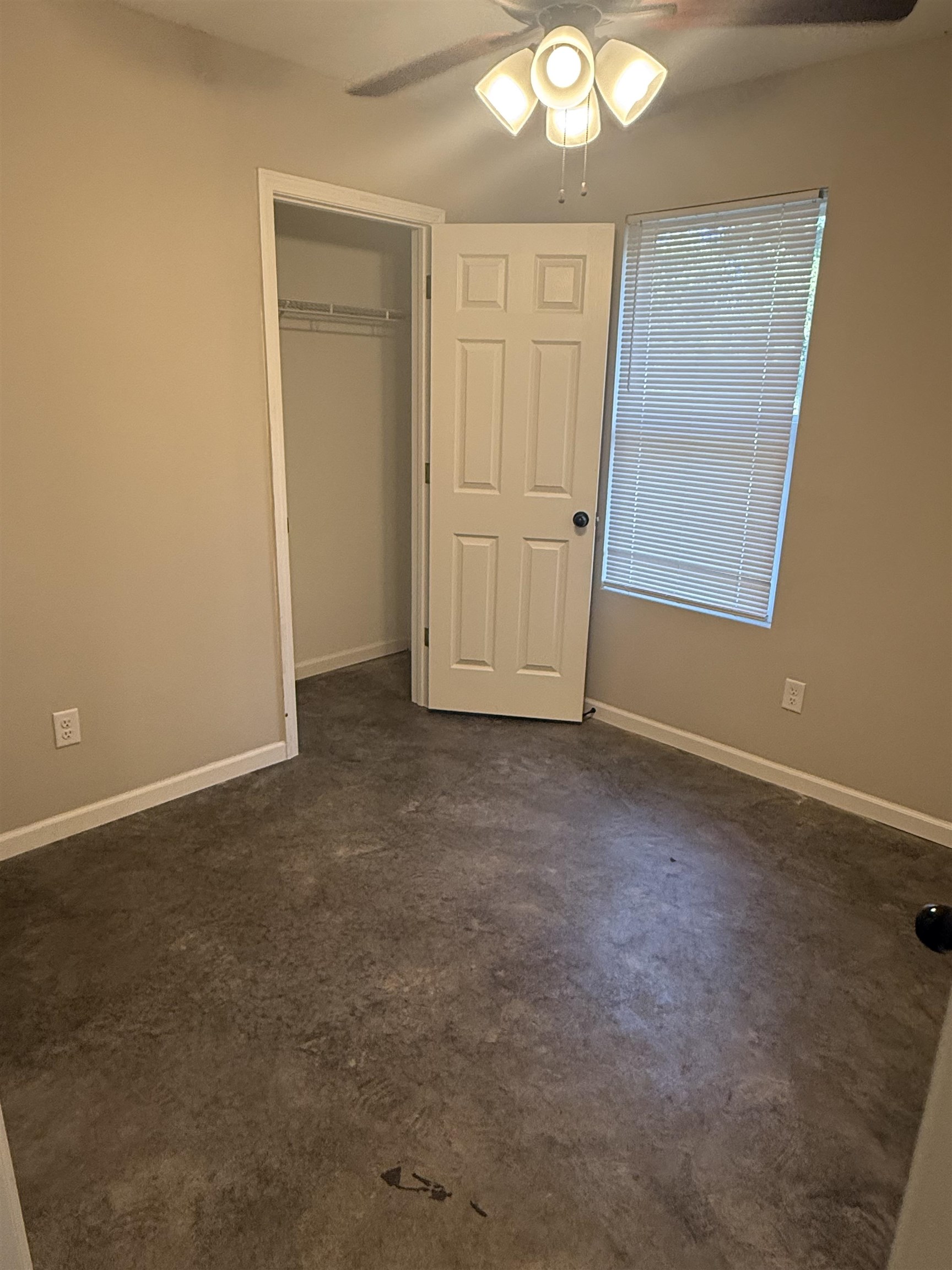 4589 Range Line Road Memphis, TN 38127 - Photo 12 of 25 Unfurnished bedroom featuring ceiling fan and a closet
