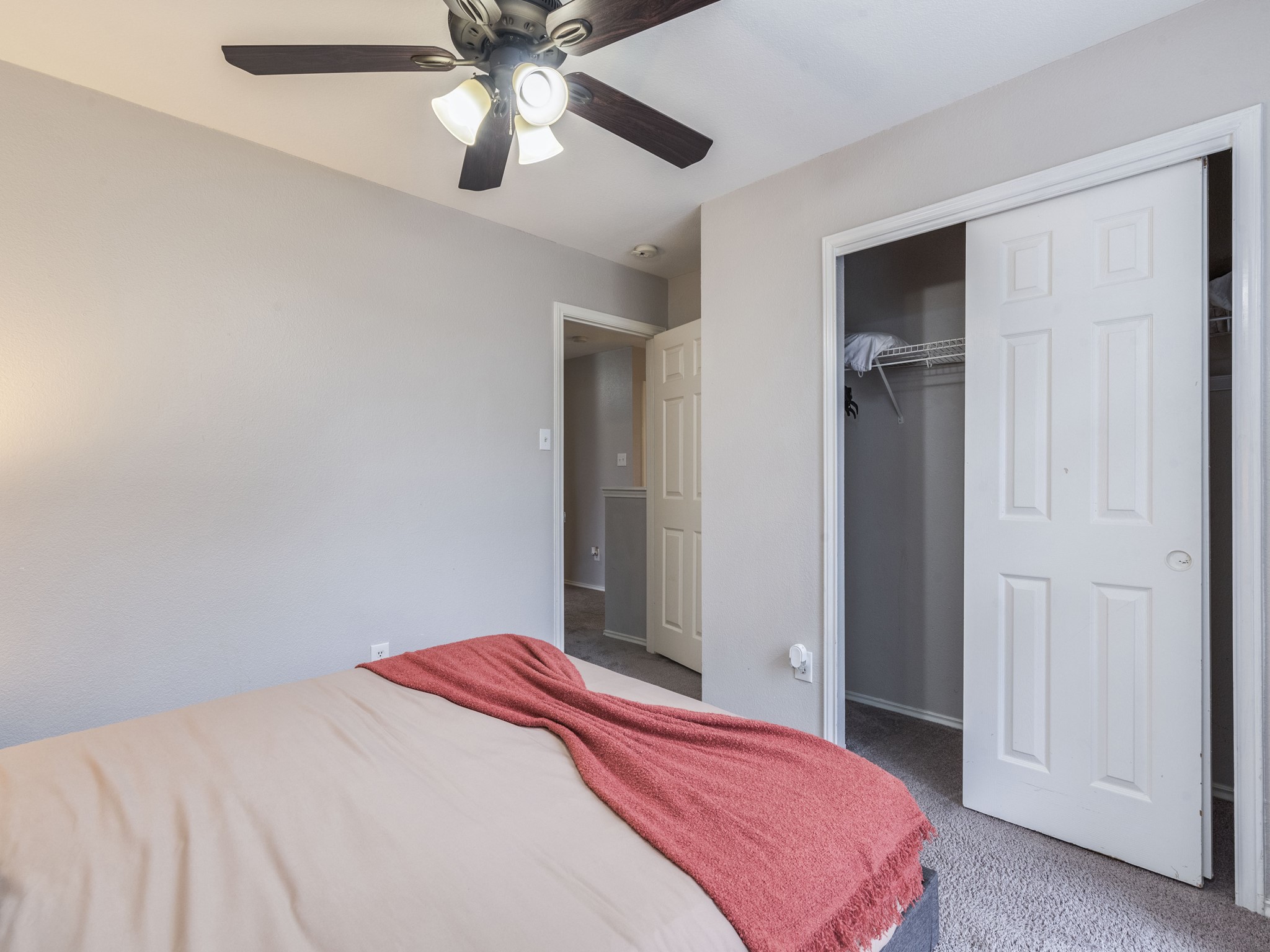 1415 Roxanne's Run Pflugerville, TX 78660 - Photo 4 of 30 Comfortable sleeping quarters include a ceiling fan and convenient closet access.