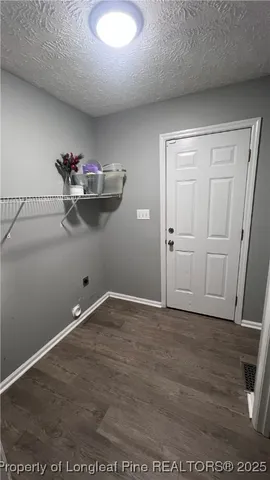 an empty room with wooden floor