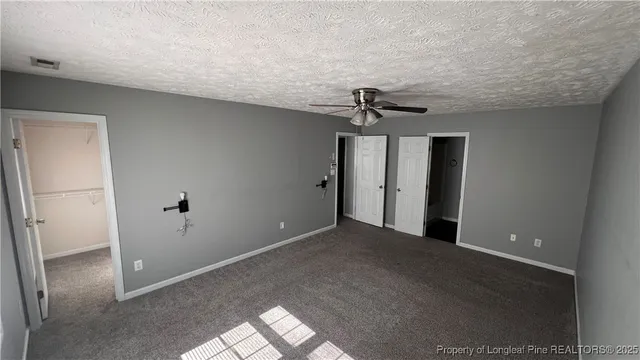 a view of a room with a hallway