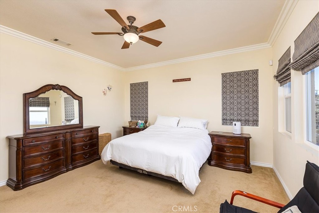 39110 Loren Way Temecula, CA 92592 - Photo 11 of 42 a bedroom with a bed and a dresser