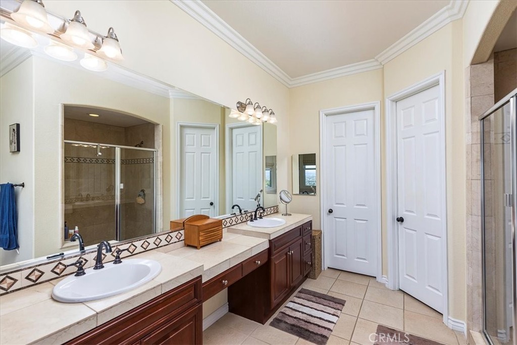 39110 Loren Way Temecula, CA 92592 - Photo 14 of 42 a bathroom with a sink double vanity granite tub and shower