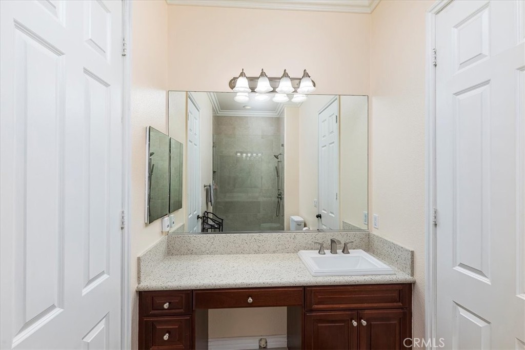 39110 Loren Way Temecula, CA 92592 - Photo 17 of 42 a bathroom with a sink and a mirror
