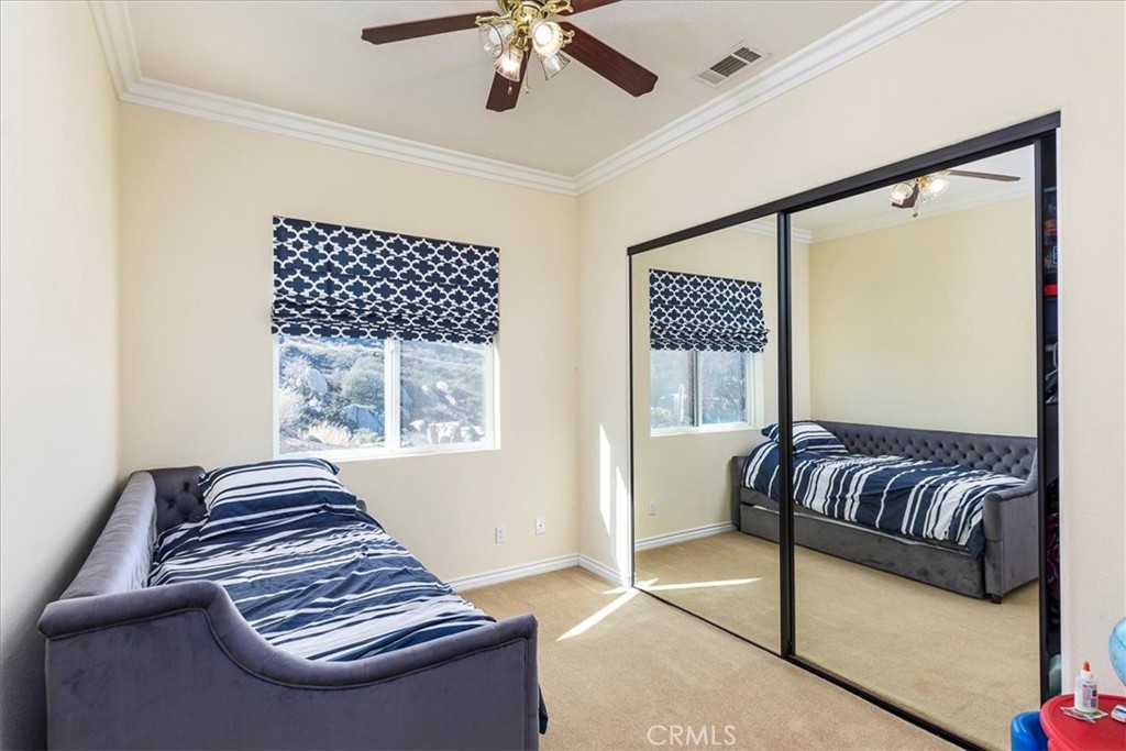 39110 Loren Way Temecula, CA 92592 - Photo 22 of 42 a bedroom with furniture and a large window