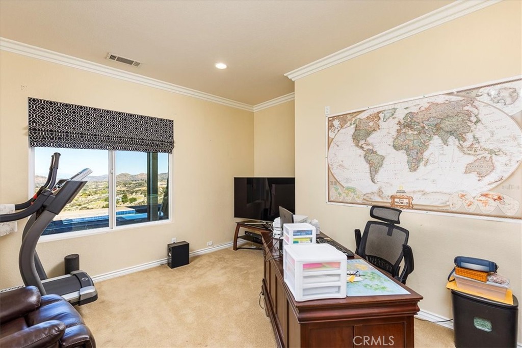 39110 Loren Way Temecula, CA 92592 - Photo 23 of 42 a bedroom with a bed and wooden floor