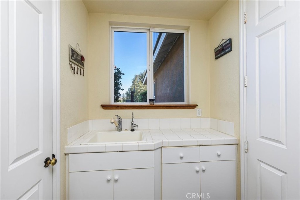 39110 Loren Way Temecula, CA 92592 - Photo 25 of 42 a bathroom with a sink and a mirror