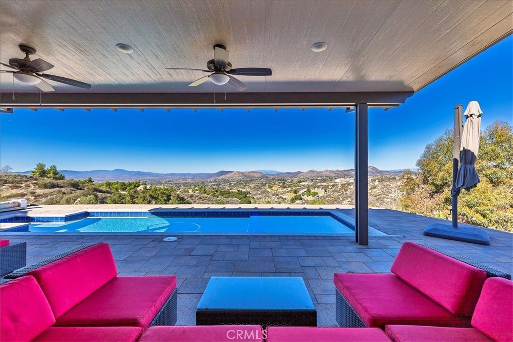 39110 Loren Way Temecula, CA 92592 - Photo 27 of 42 a view of a living room with furniture and a flat screen tv