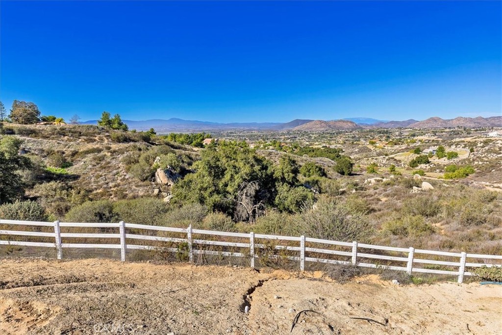 39110 Loren Way Temecula, CA 92592 - Photo 33 of 42 a view of a yard with wooden fence
