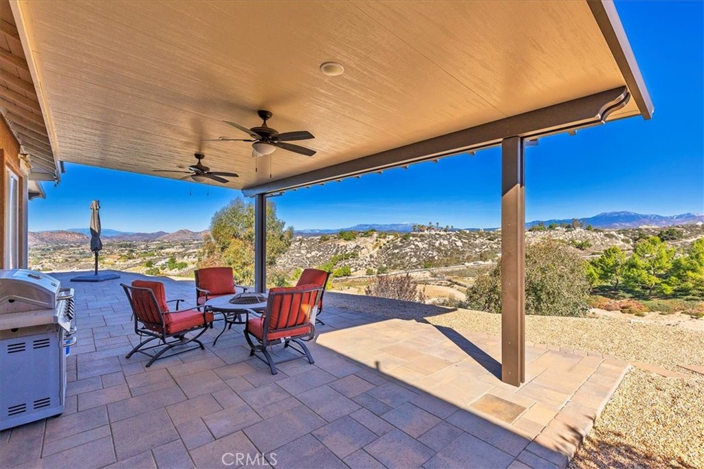 39110 Loren Way Temecula, CA 92592 - Photo 42 of 42 a view of a patio with a table and chairs