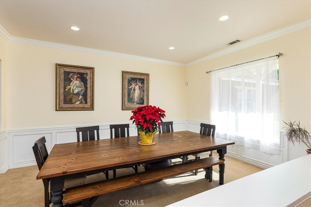 39110 Loren Way Temecula, CA 92592 - Photo 5 of 42 a view of a dining room with furniture and wooden floor