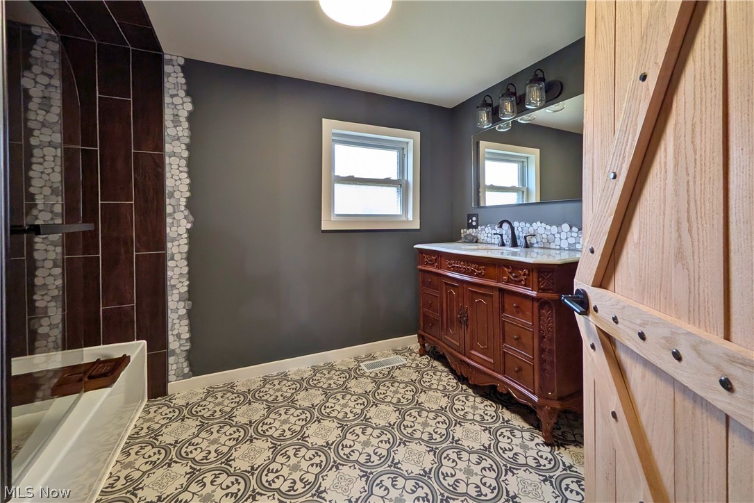 12972 Gilmore Road Southeast Port Washington, OH 43837 - Photo 20 of 50 Full bathroom featuring vanity and light tile patterned floors