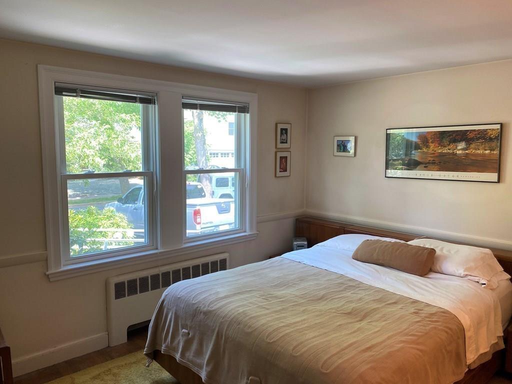 25 Clearwater Road Newton, MA 02462 - Photo 12 of 23 a bedroom with a bed and a window