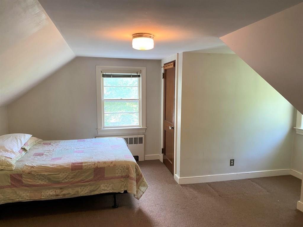 25 Clearwater Road Newton, MA 02462 - Photo 13 of 23 a bedroom with a bed and a window