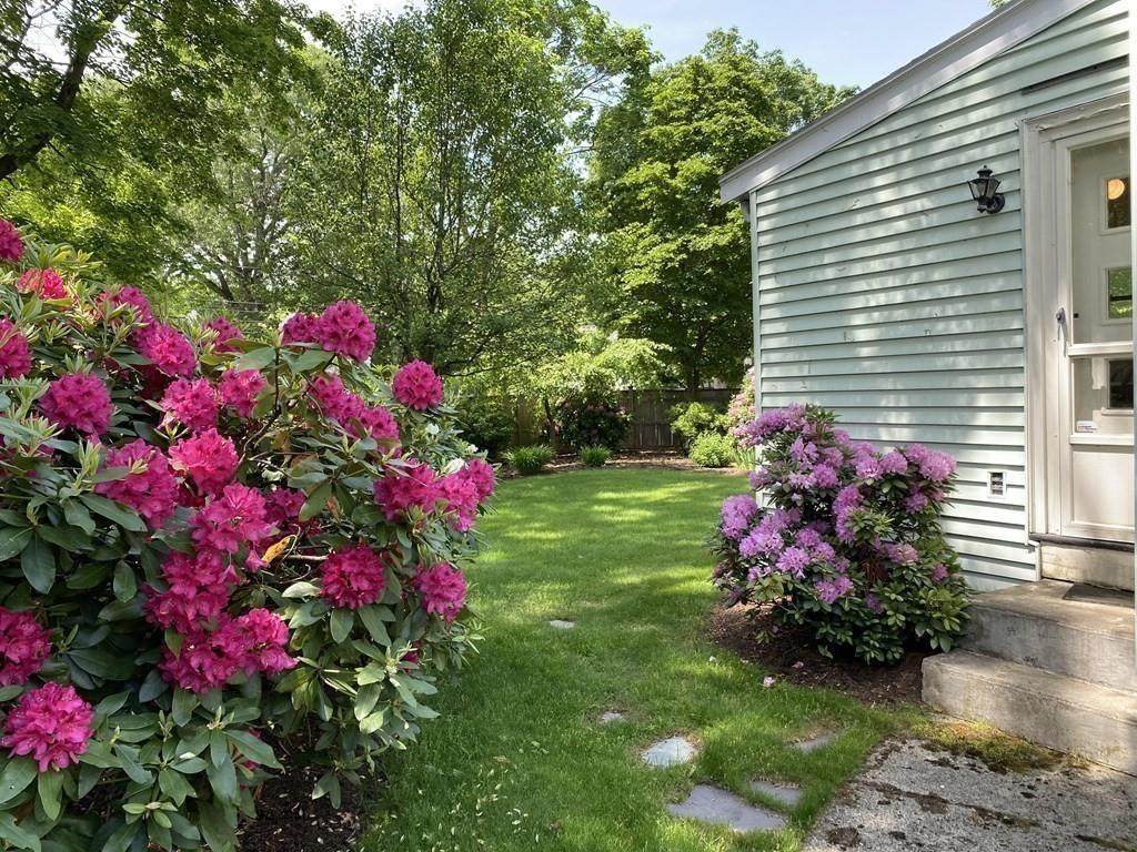 25 Clearwater Road Newton, MA 02462 - Photo 18 of 23 a view of a house with a yard and garden