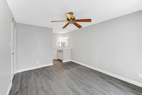 a view of a hallway view with wooden floor and staircase