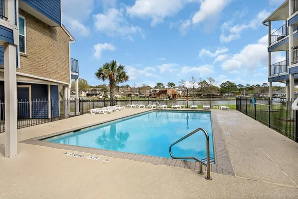 a view of a swimming pool with a lounge chair