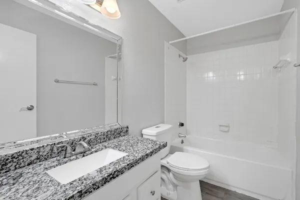 an aerial view of a house with outdoor space and lake view