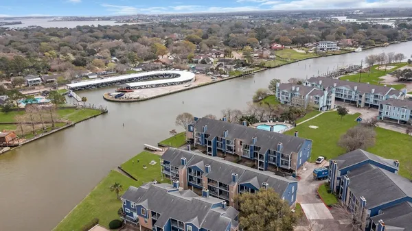 an aerial view of a house with a lake view