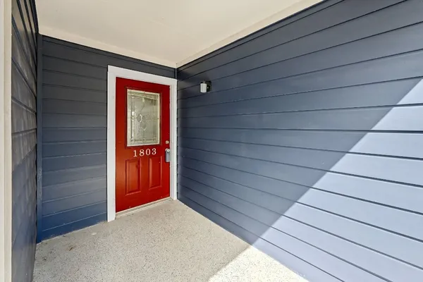 a view of a kitchen stove and cabinets with wooden floor