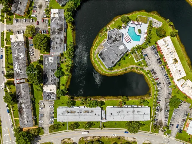 an aerial view of a house with a swimming pool