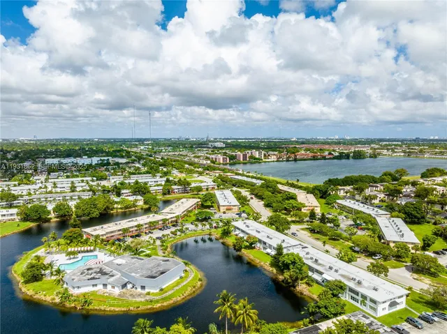 a view of a swimming pool with a table and chairs