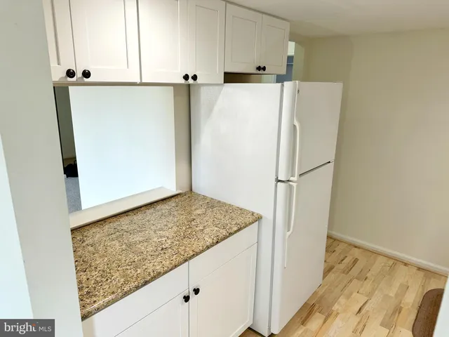 a view of bathroom with a sink and mirror