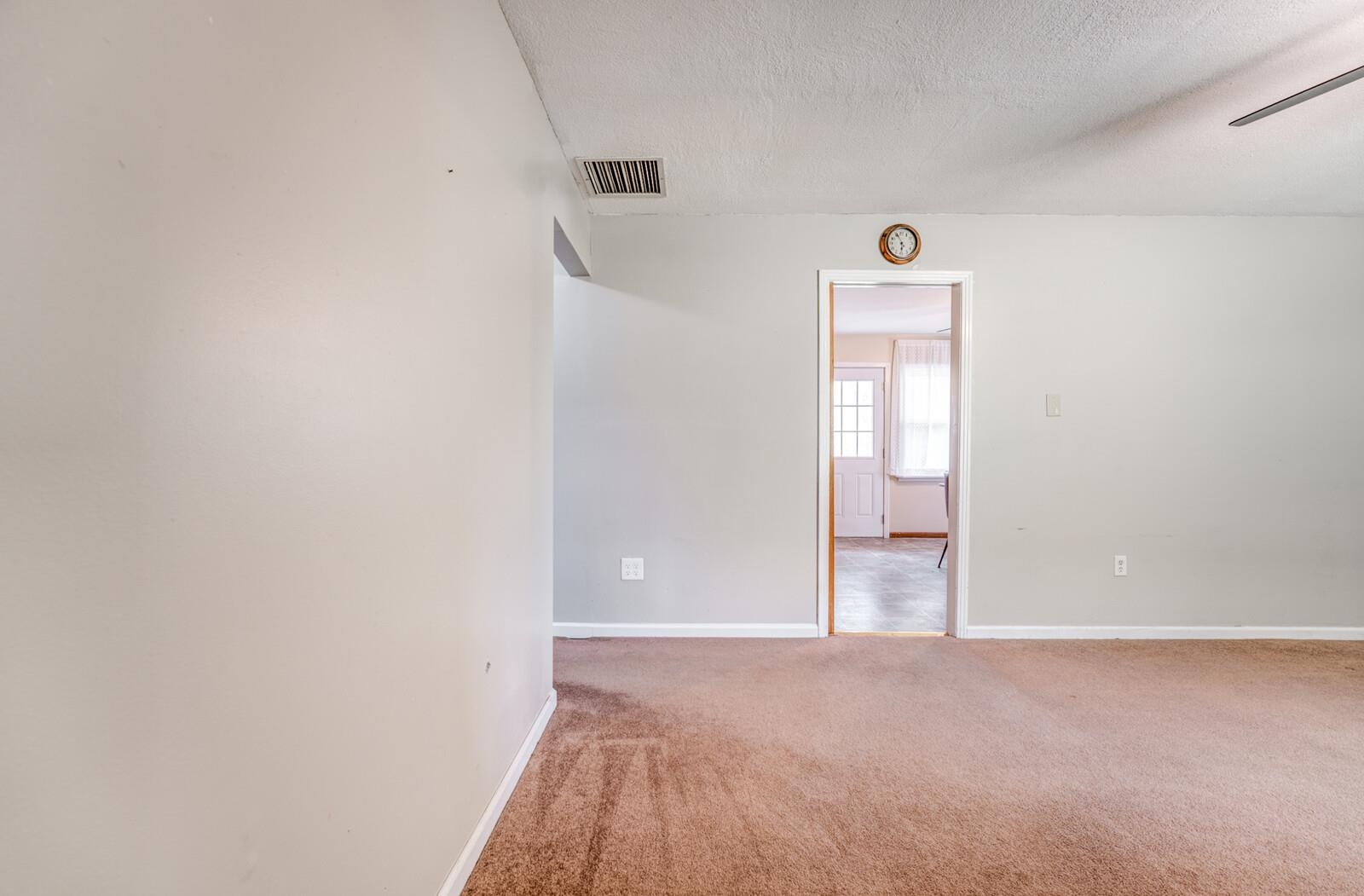 6125 Warren Road Oakland, TN 38060 - Photo 6 of 40 Interior room featuring light-colored walls and brown carpeting