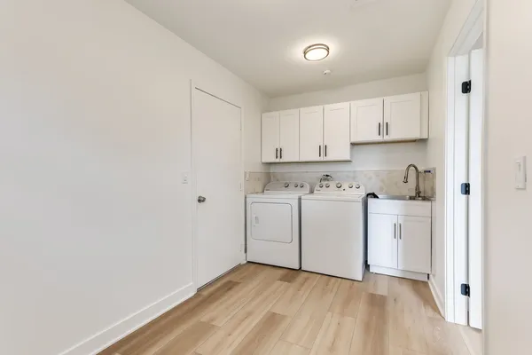 a view of kitchen with wooden floor