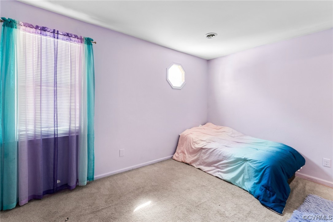4717 Crossgate Road Chester, VA 23831 - Photo 20 of 34 a bedroom with a bed and a window