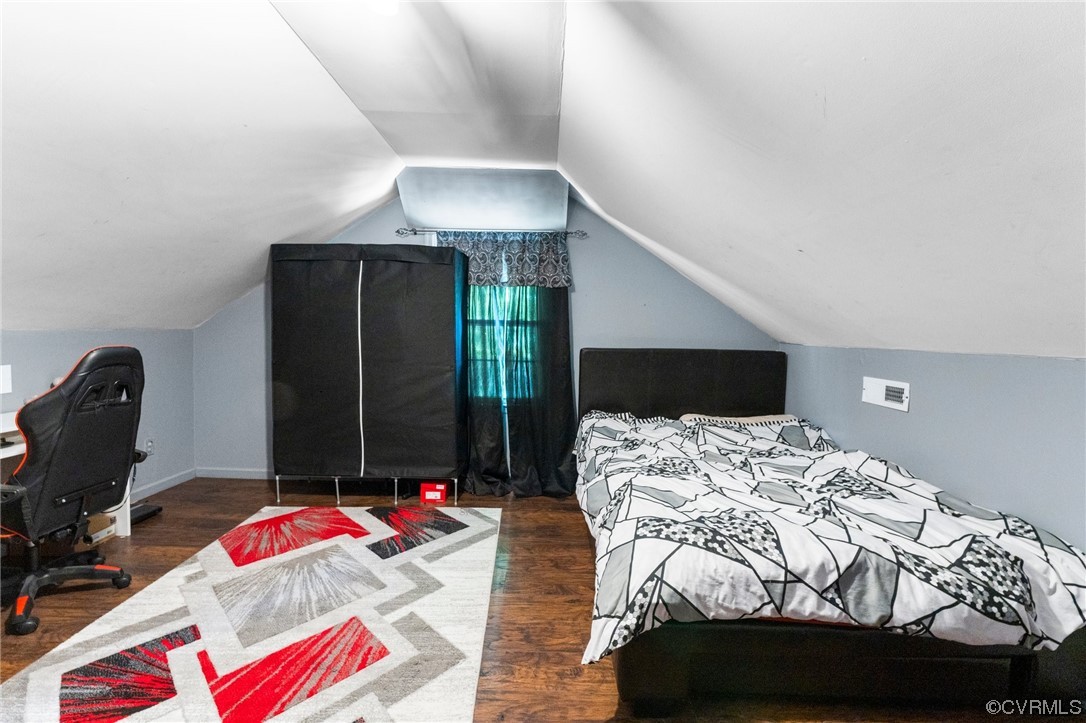 4717 Crossgate Road Chester, VA 23831 - Photo 27 of 34 a bedroom with a bed and glass window