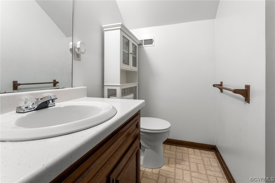 4717 Crossgate Road Chester, VA 23831 - Photo 28 of 34 a bathroom with a sink a toilet and shower
