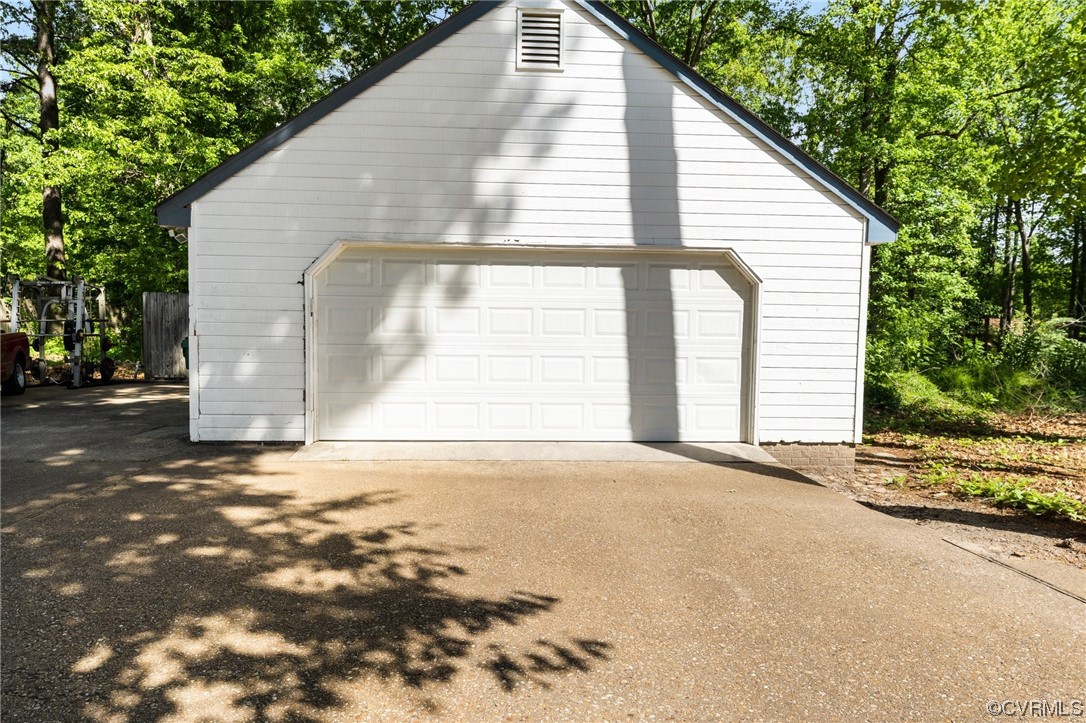 4717 Crossgate Road Chester, VA 23831 - Photo 31 of 34 a view of a house with a yard and garage