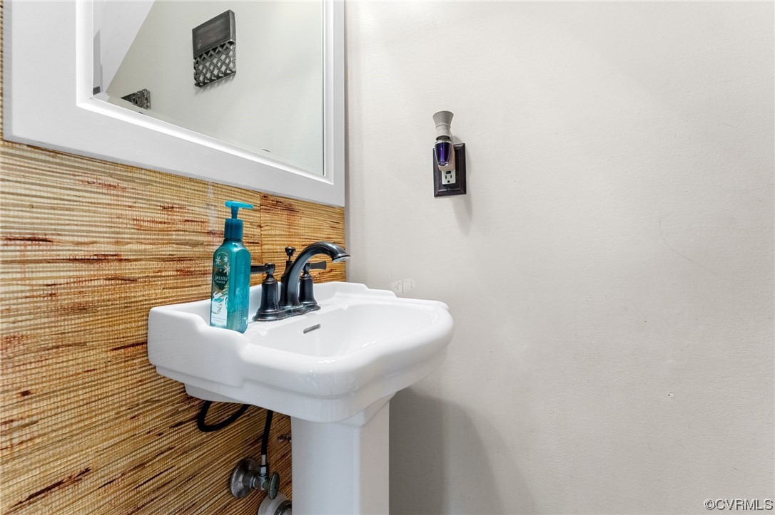 4717 Crossgate Road Chester, VA 23831 - Photo 8 of 34 a bathroom with a sink a toilet and mirror