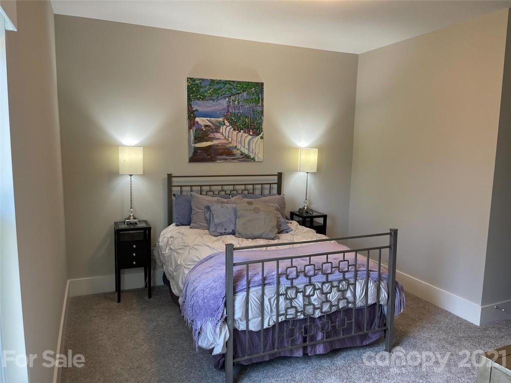 3508 Ritch Avenue Charlotte, NC 28206 - Photo 21 of 33 a bedroom with a bed and a lamp on the dresser