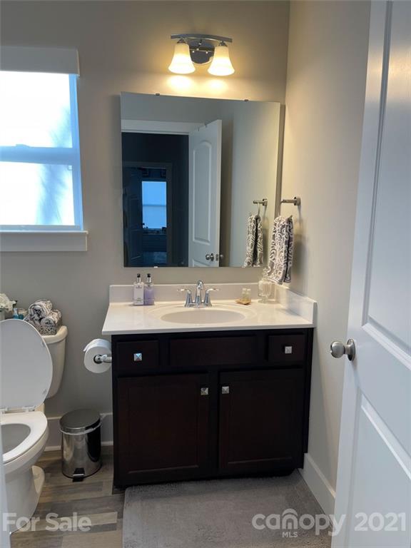 3508 Ritch Avenue Charlotte, NC 28206 - Photo 22 of 33 a bathroom with a sink and a mirror