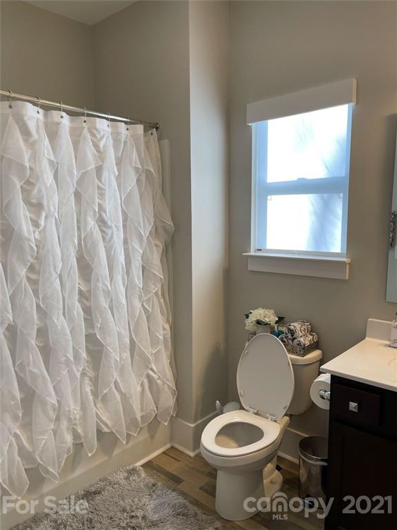 3508 Ritch Avenue Charlotte, NC 28206 - Photo 23 of 33 a bathroom with a granite countertop toilet and a sink