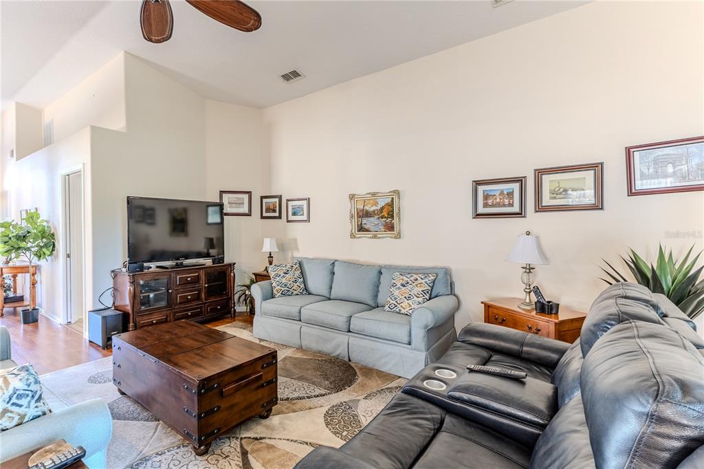 150 Gordham Court Spring Hill, FL 34609 - Photo 18 of 71 a living room with furniture and a flat screen tv