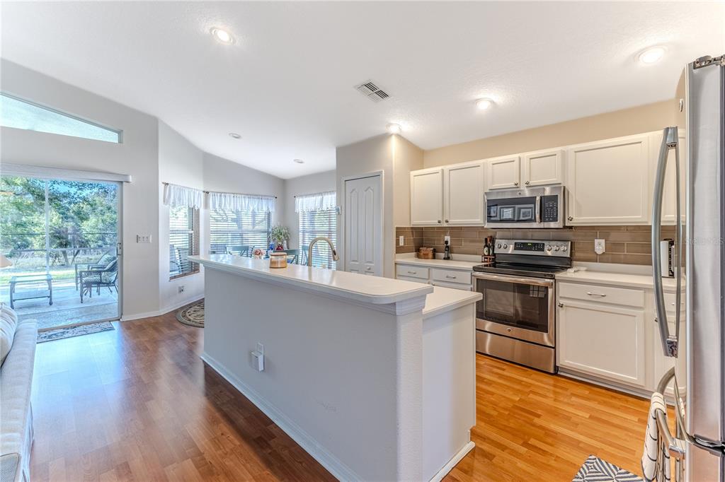 150 Gordham Court Spring Hill, FL 34609 - Photo 22 of 71 a kitchen with stainless steel appliances a refrigerator sink and microwave