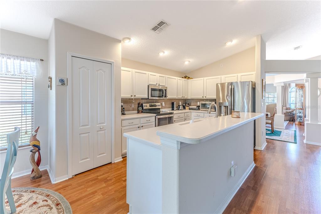 150 Gordham Court Spring Hill, FL 34609 - Photo 23 of 71 a large white kitchen with a large window