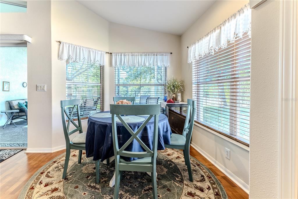 150 Gordham Court Spring Hill, FL 34609 - Photo 29 of 71 a view of a dining room with furniture and wooden floor