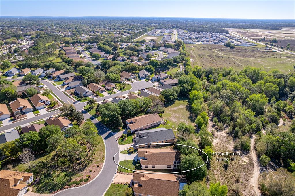 150 Gordham Court Spring Hill, FL 34609 - Photo 30 of 71 an aerial view of residential houses with outdoor space