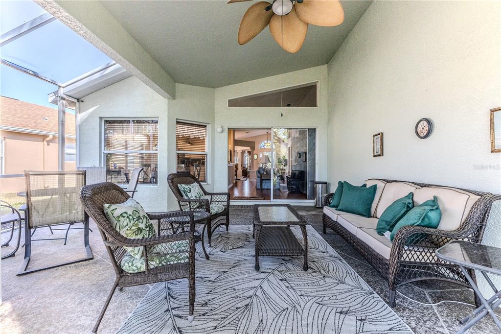 150 Gordham Court Spring Hill, FL 34609 - Photo 33 of 71 a living room with furniture dining table and a large window