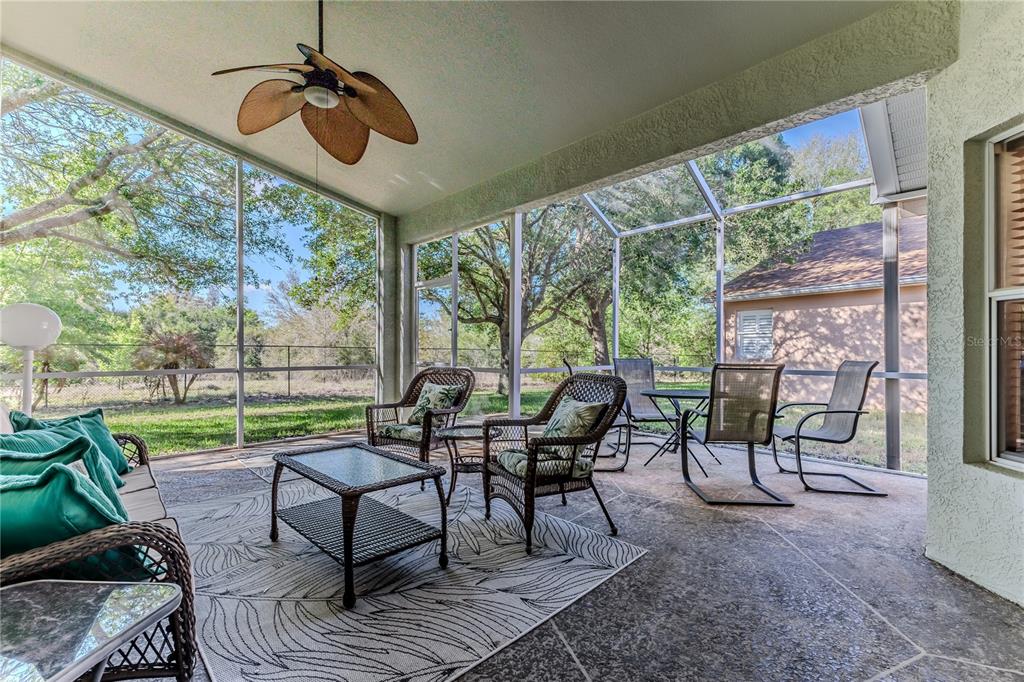 150 Gordham Court Spring Hill, FL 34609 - Photo 34 of 71 a view of a tables and chairs in patio