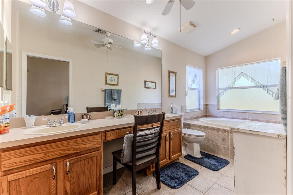 150 Gordham Court Spring Hill, FL 34609 - Photo 39 of 71 a bathroom with a sink a vanity and a mirror