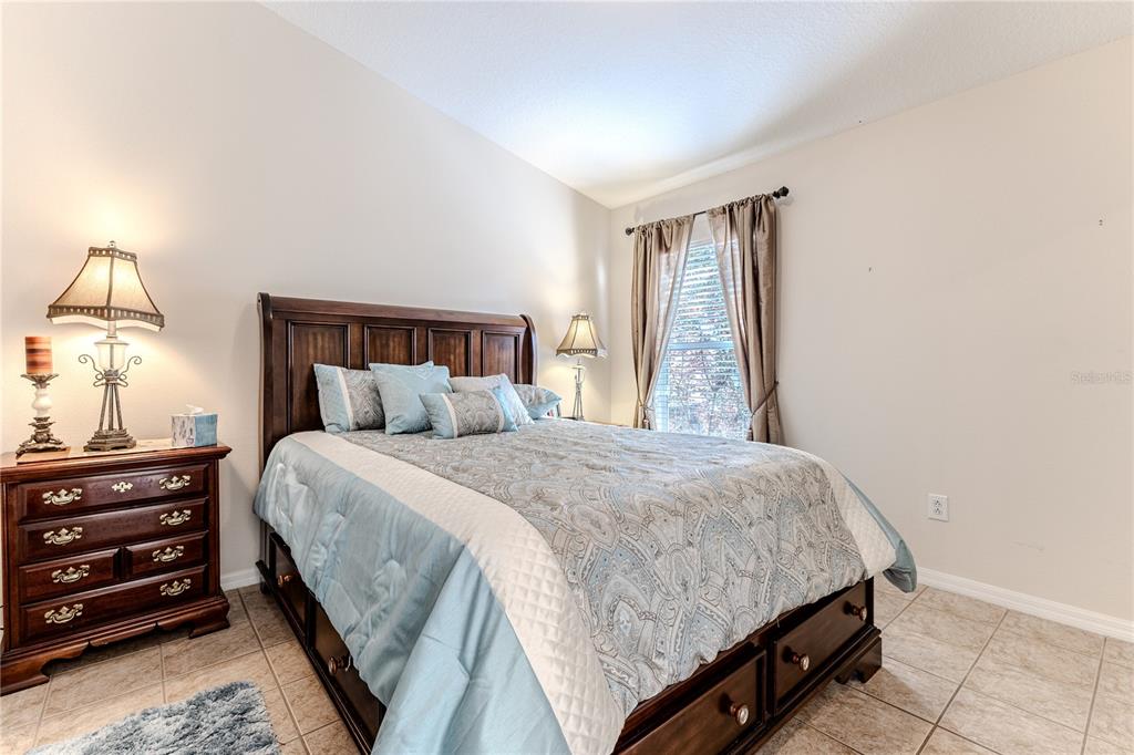 150 Gordham Court Spring Hill, FL 34609 - Photo 50 of 71 a bedroom with a bed and a window