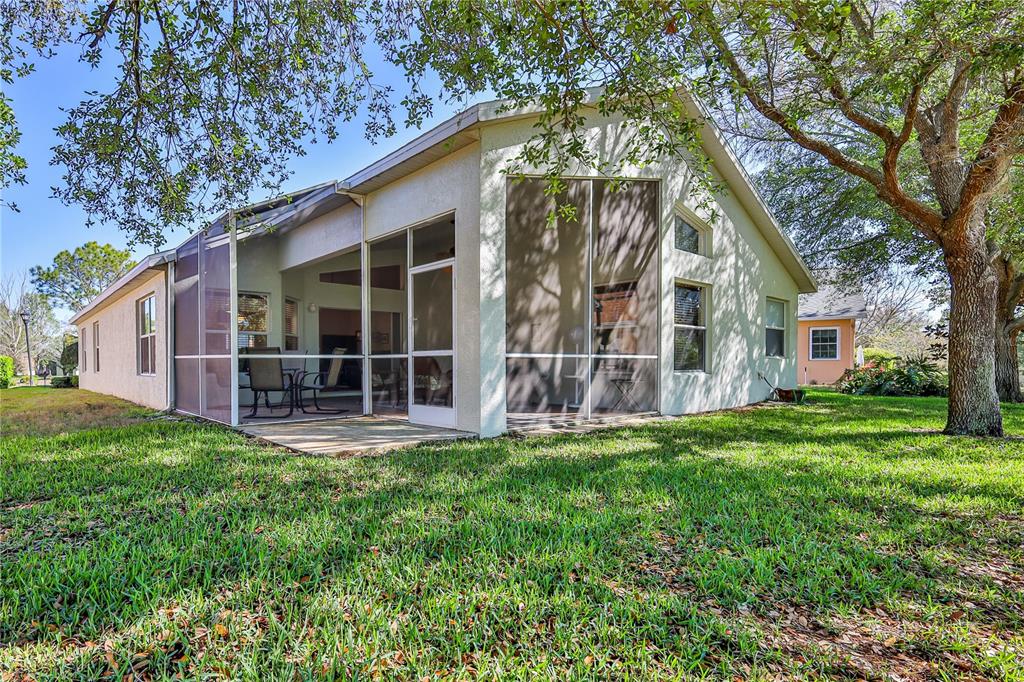150 Gordham Court Spring Hill, FL 34609 - Photo 58 of 71 a view of a house with a yard and sitting area